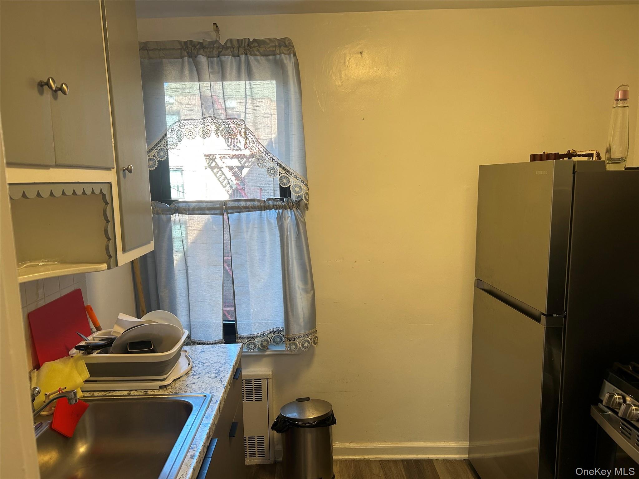 83-20 98th Street, Unit 5J Queens, NY 11421 - Photo 9 of 17 a view of walk in closet with clothes and shoes