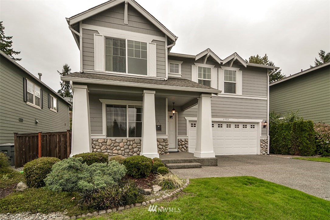 2402 Southeast 2nd Place Renton, WA 98056 - Photo 1 of 40 front view of a house with a yard