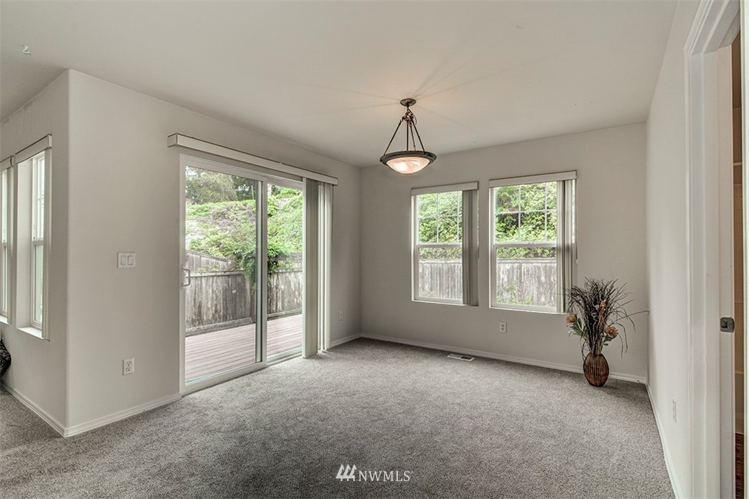 2402 Southeast 2nd Place Renton, WA 98056 - Photo 12 of 40 a view of room with window and hardwood floor