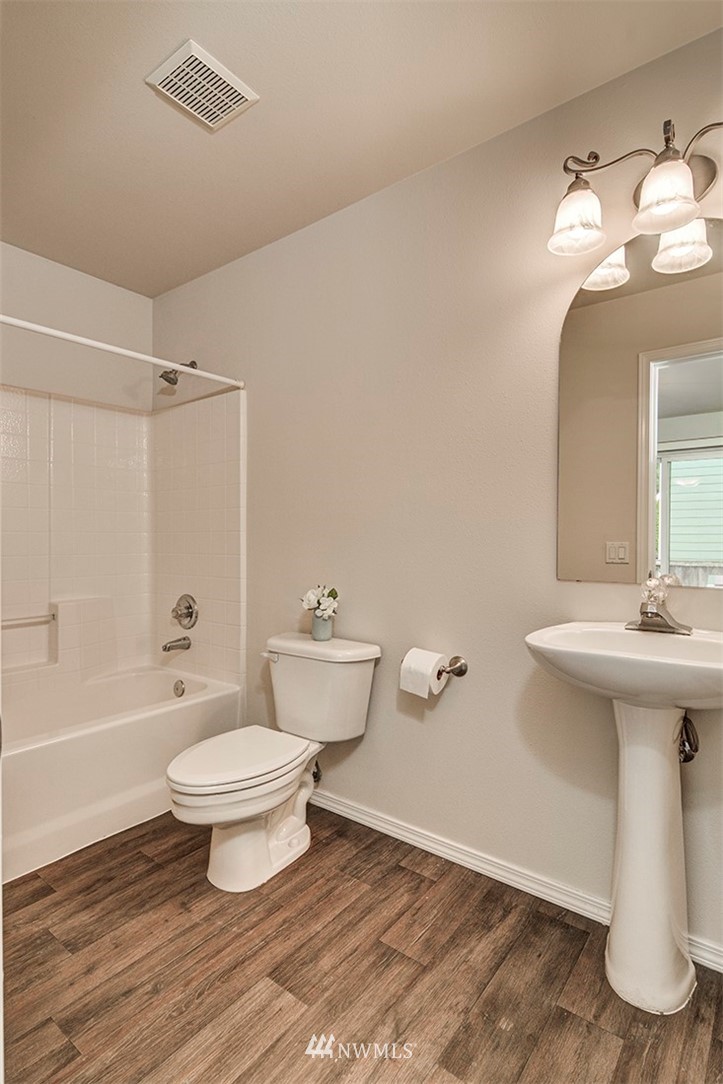 2402 Southeast 2nd Place Renton, WA 98056 - Photo 17 of 40 a bathroom with a sink toilet a shower and a mirror