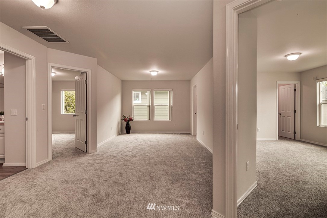 2402 Southeast 2nd Place Renton, WA 98056 - Photo 20 of 40 a view of a room with window and wooden floor
