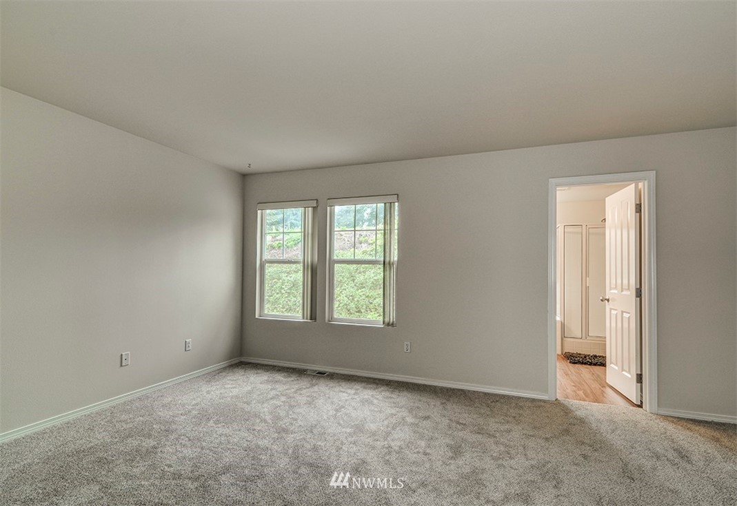 2402 Southeast 2nd Place Renton, WA 98056 - Photo 25 of 40 an empty room with windows