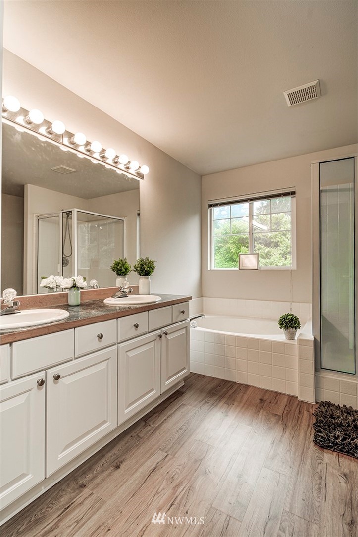 2402 Southeast 2nd Place Renton, WA 98056 - Photo 27 of 40 a spacious bathroom with a large tub and shower