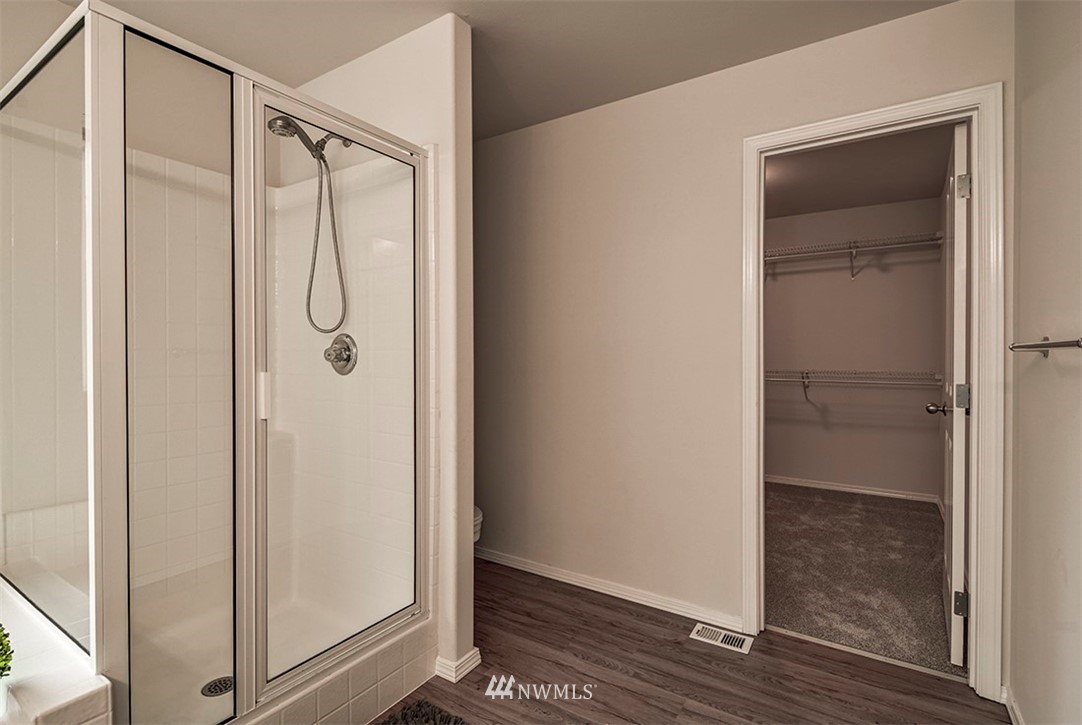 2402 Southeast 2nd Place Renton, WA 98056 - Photo 28 of 40 a bathroom with a glass shower door