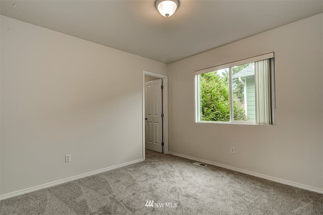 2402 Southeast 2nd Place Renton, WA 98056 - Photo 32 of 40 an empty room with a window