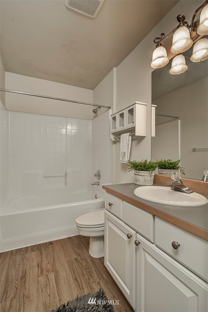 2402 Southeast 2nd Place Renton, WA 98056 - Photo 33 of 40 a bathroom with a sink a toilet and bathtub