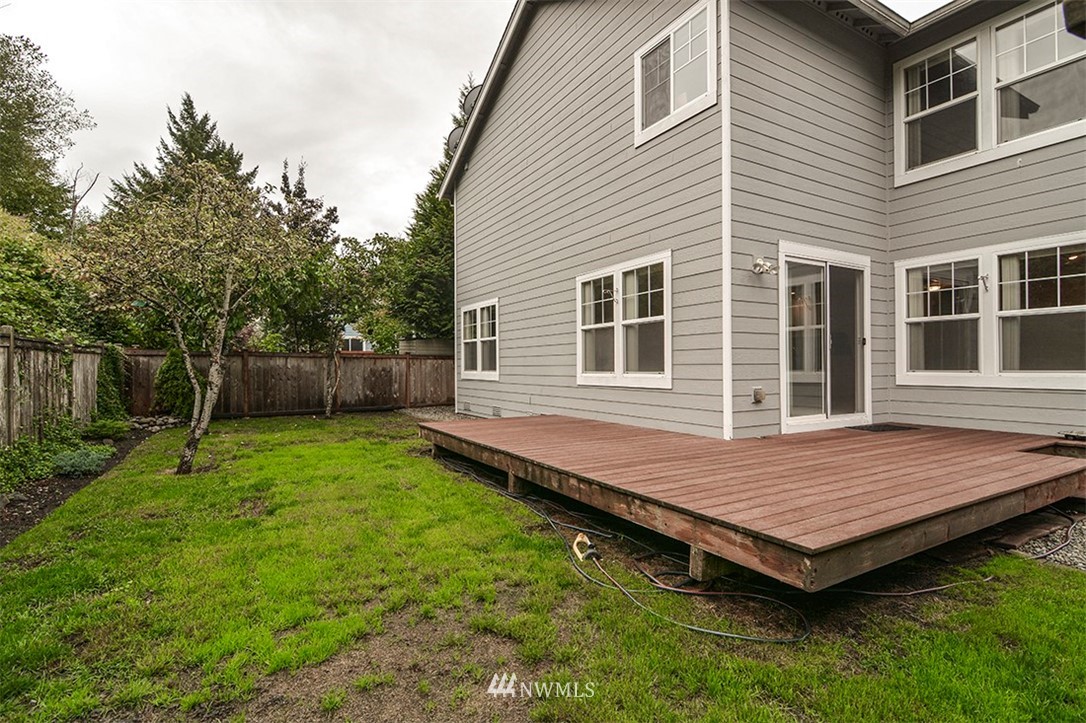 2402 Southeast 2nd Place Renton, WA 98056 - Photo 37 of 40 a view of a backyard with a barbeque grill and wooden fence