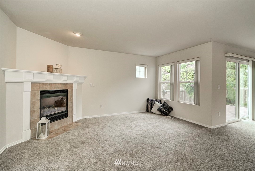 2402 Southeast 2nd Place Renton, WA 98056 - Photo 9 of 40 a living room with furniture and a fireplace