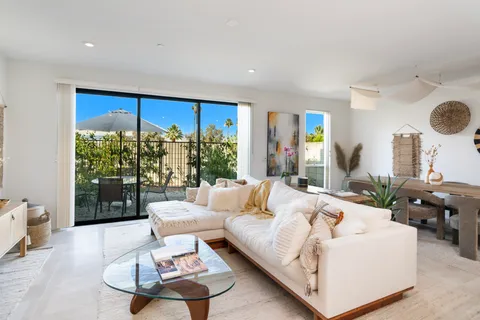 a view of living room with granite countertop furniture and a large window