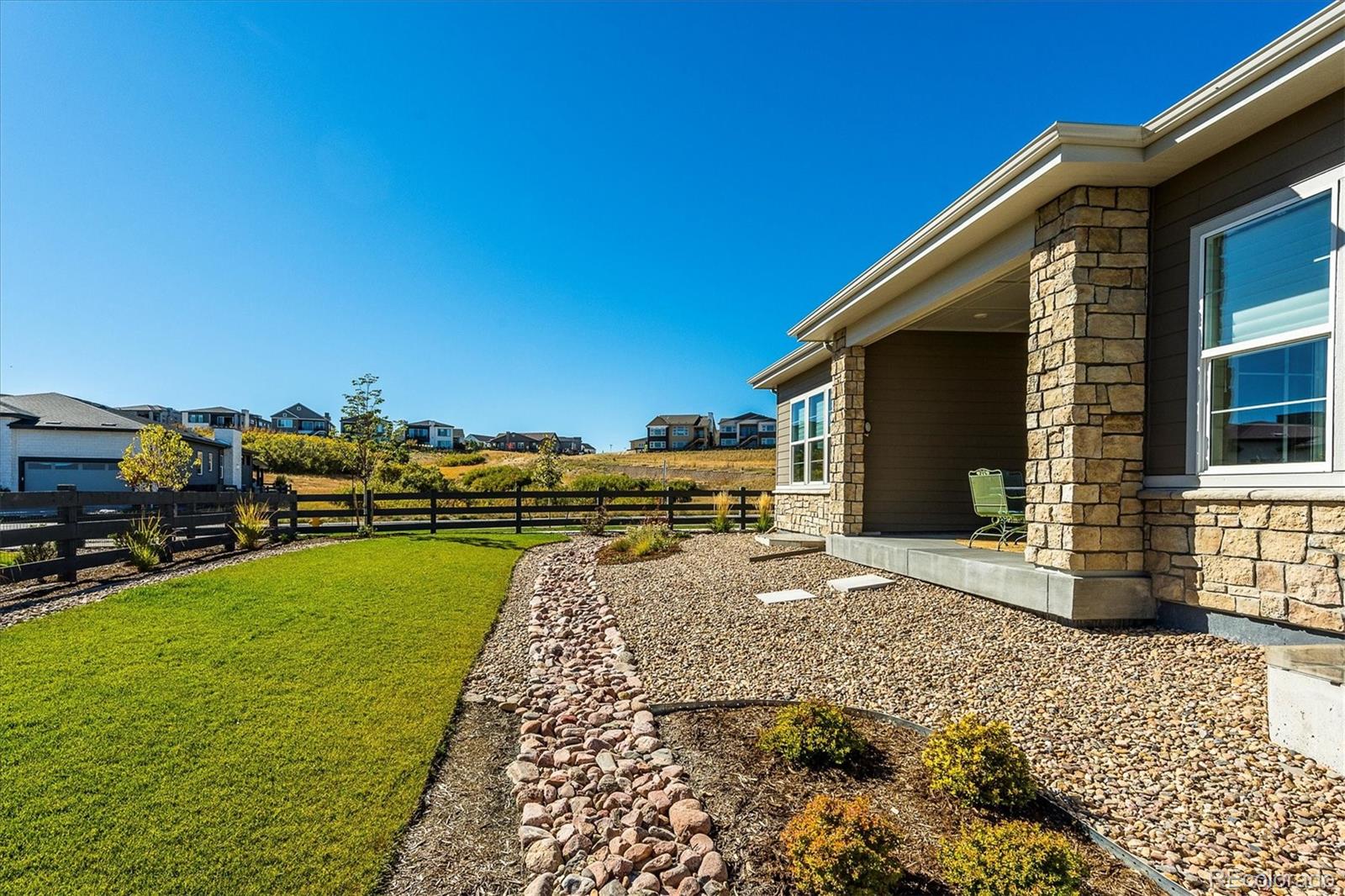 7334 Canyonpoint Road Castle Pines, CO 80108 - Photo 35 of 50 a view of a backyard with sitting area