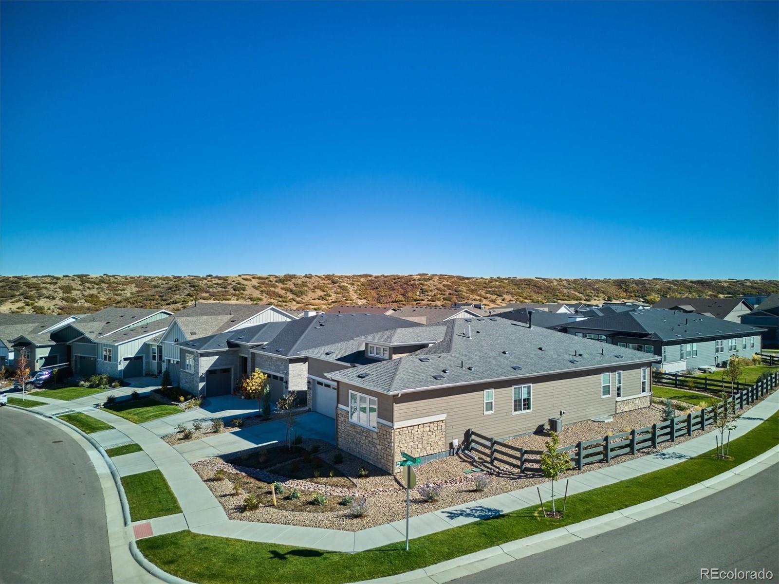 7334 Canyonpoint Road Castle Pines, CO 80108 - Photo 39 of 50 a view of a city with tall buildings in front of it