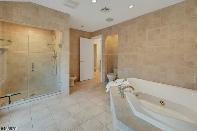 a bathroom with a tub shower and a sink