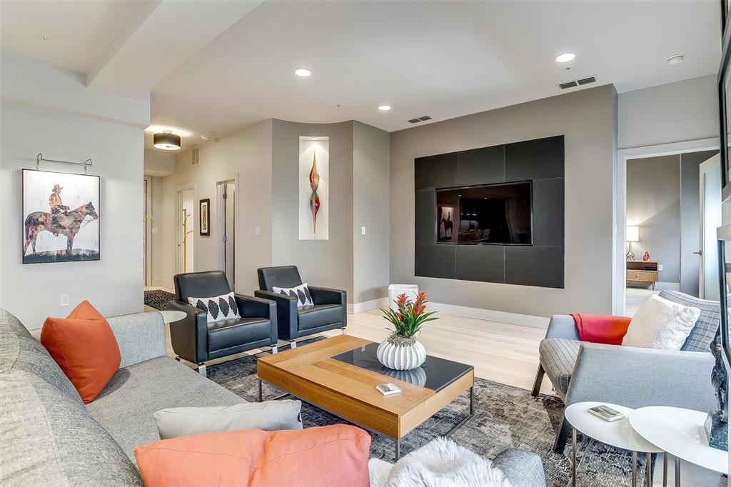 a living room with furniture kitchen and a table