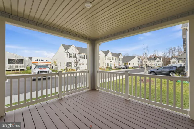 a view of a balcony with wooden floor
