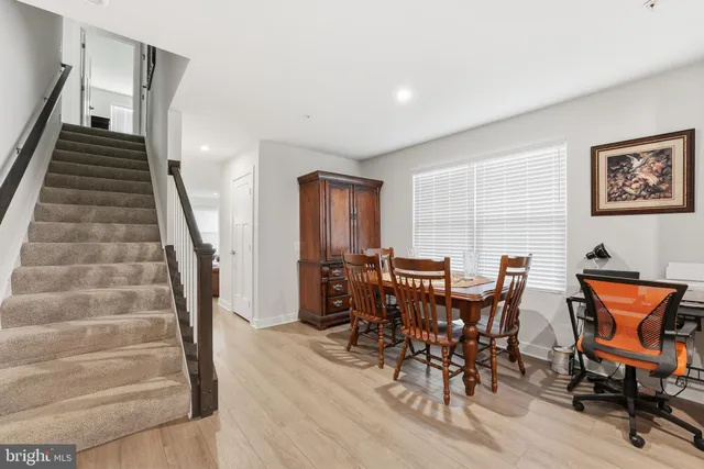 a view of a livingroom with furniture and lounge chair