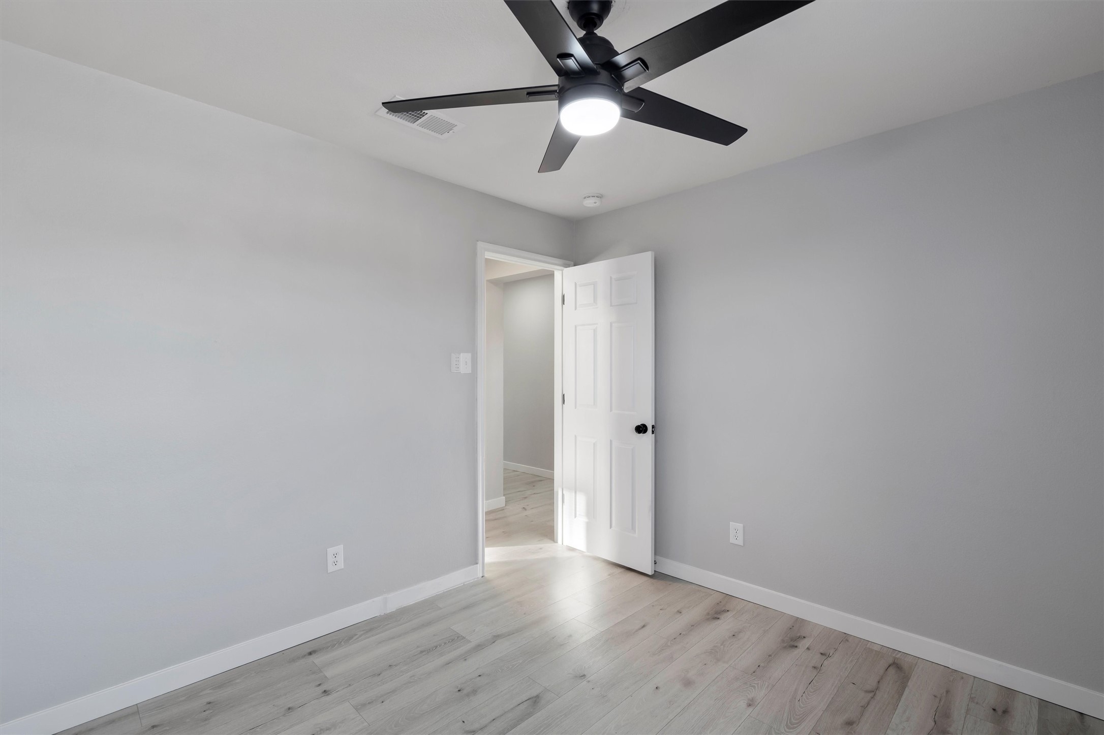 313 Drystone Trail Liberty Hill, TX 78642 - Photo 15 of 17 Spare room with light wood-style floors and a ceiling fan