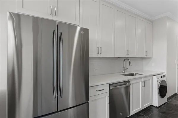 a view of a kitchen with appliances