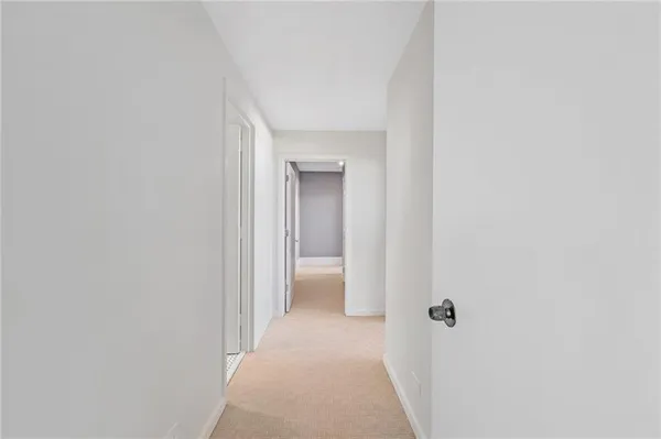 a view of a hallway with a white walls