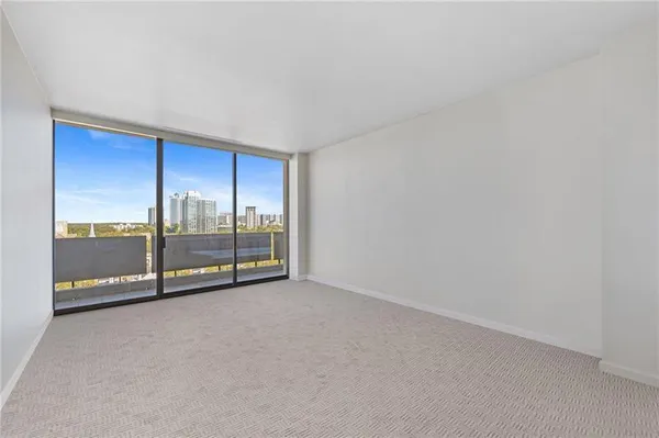 a view of an empty room with a window