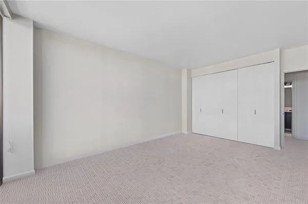 a view of an empty room and entryway