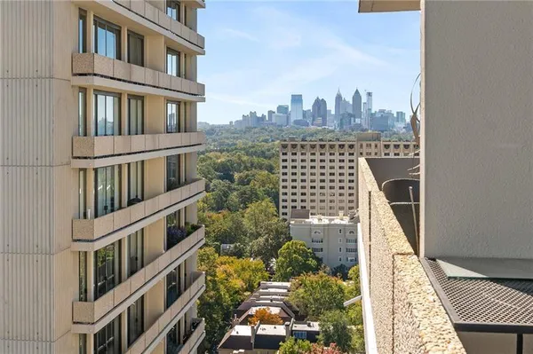 a view of a buildings with a yard