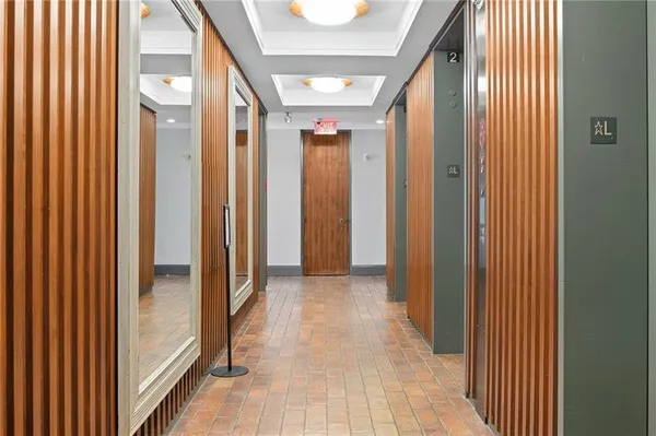 a view of hallway with wooden floor