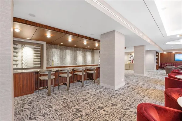 a view of a lobby area with furniture and windows