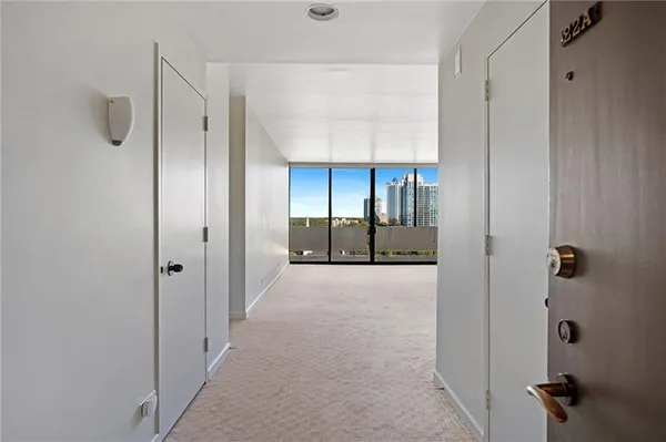 a view of a bathroom with a glass door shower