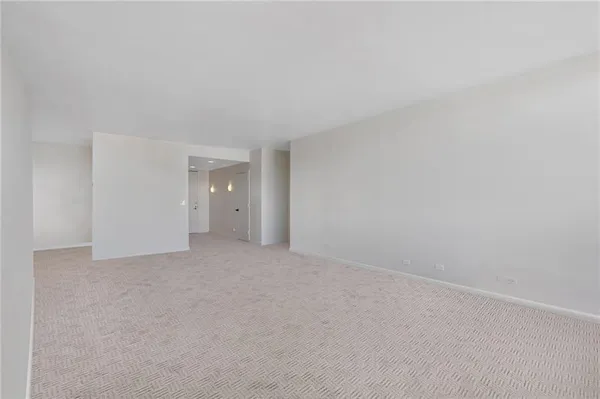 a view of an empty room and window