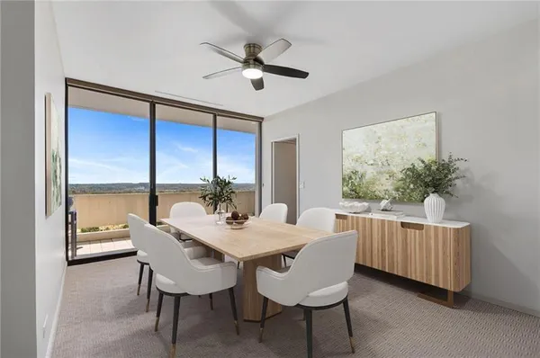 a view of a dining room with furniture window and outside view