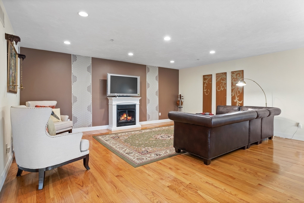 215 Rangeway Road, Unit 32 Billerica, MA 01862 - Photo 13 of 39 a living room with furniture and a fireplace