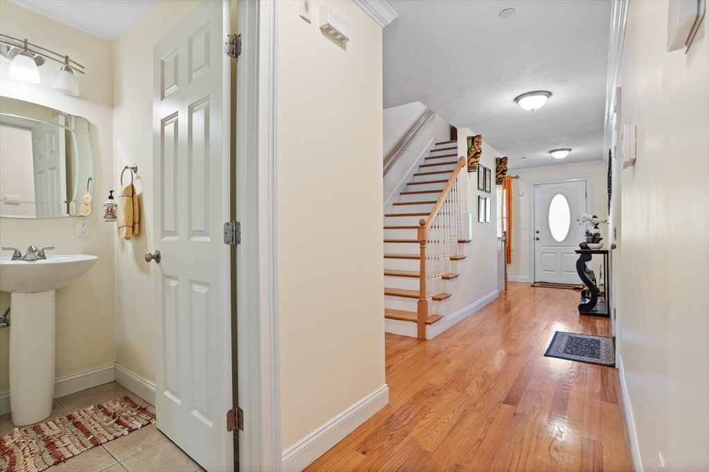 215 Rangeway Road, Unit 32 Billerica, MA 01862 - Photo 16 of 39 a view of a hallway with wooden floor and staircase