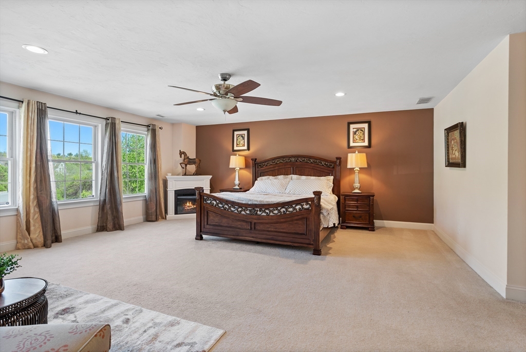 215 Rangeway Road, Unit 32 Billerica, MA 01862 - Photo 17 of 39 a spacious bedroom with a bed and a large window
