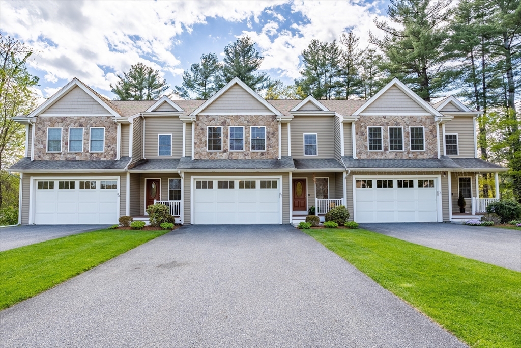 215 Rangeway Road, Unit 32 Billerica, MA 01862 - Photo 2 of 39 a front view of a house with a yard and garage