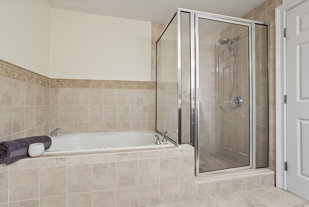 215 Rangeway Road, Unit 32 Billerica, MA 01862 - Photo 21 of 39 a bathroom with a shower and a bathtub
