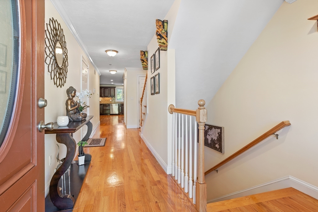 215 Rangeway Road, Unit 32 Billerica, MA 01862 - Photo 3 of 39 a view of a hallway with wooden floor and stairs