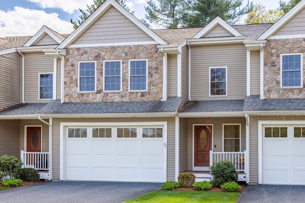 215 Rangeway Road, Unit 32 Billerica, MA 01862 - Photo 34 of 39 a front view of a house with a yard and potted plants