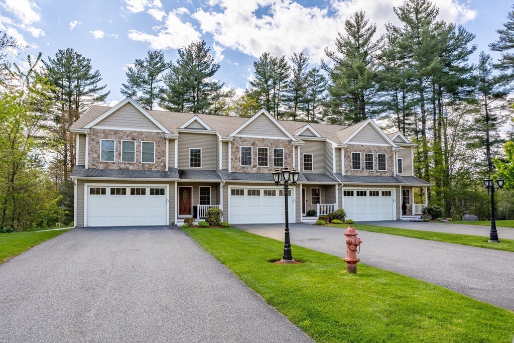 215 Rangeway Road, Unit 32 Billerica, MA 01862 - Photo 36 of 39 a front view of a house with a yard and trees