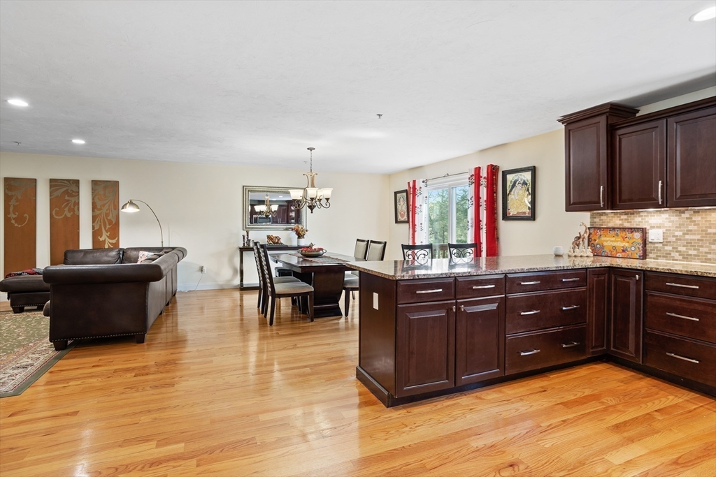 215 Rangeway Road, Unit 32 Billerica, MA 01862 - Photo 9 of 39 a kitchen with stainless steel appliances granite countertop a stove and cabinets