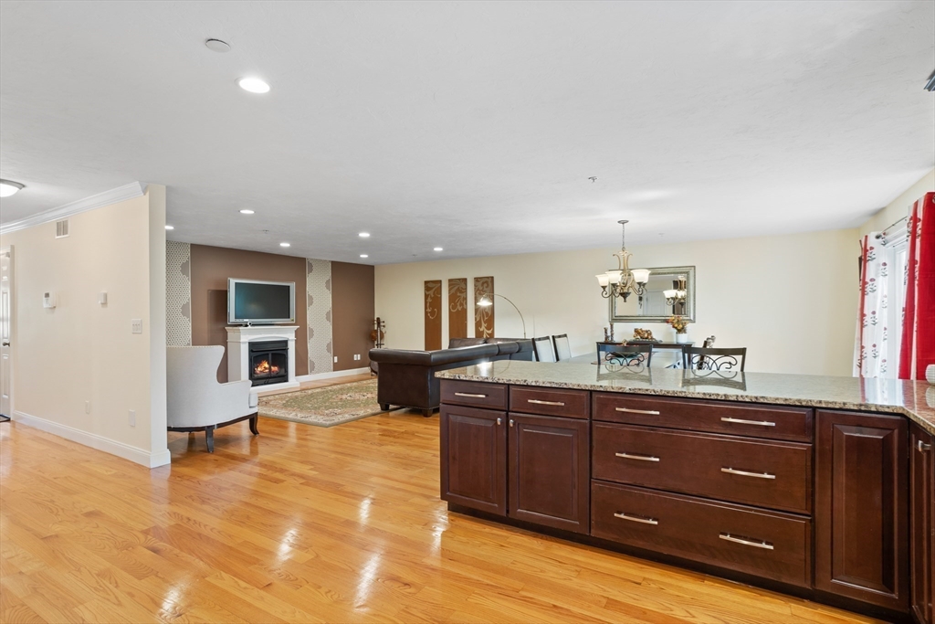 215 Rangeway Road, Unit 32 Billerica, MA 01862 - Photo 10 of 39 a kitchen with granite countertop a sink and cabinets