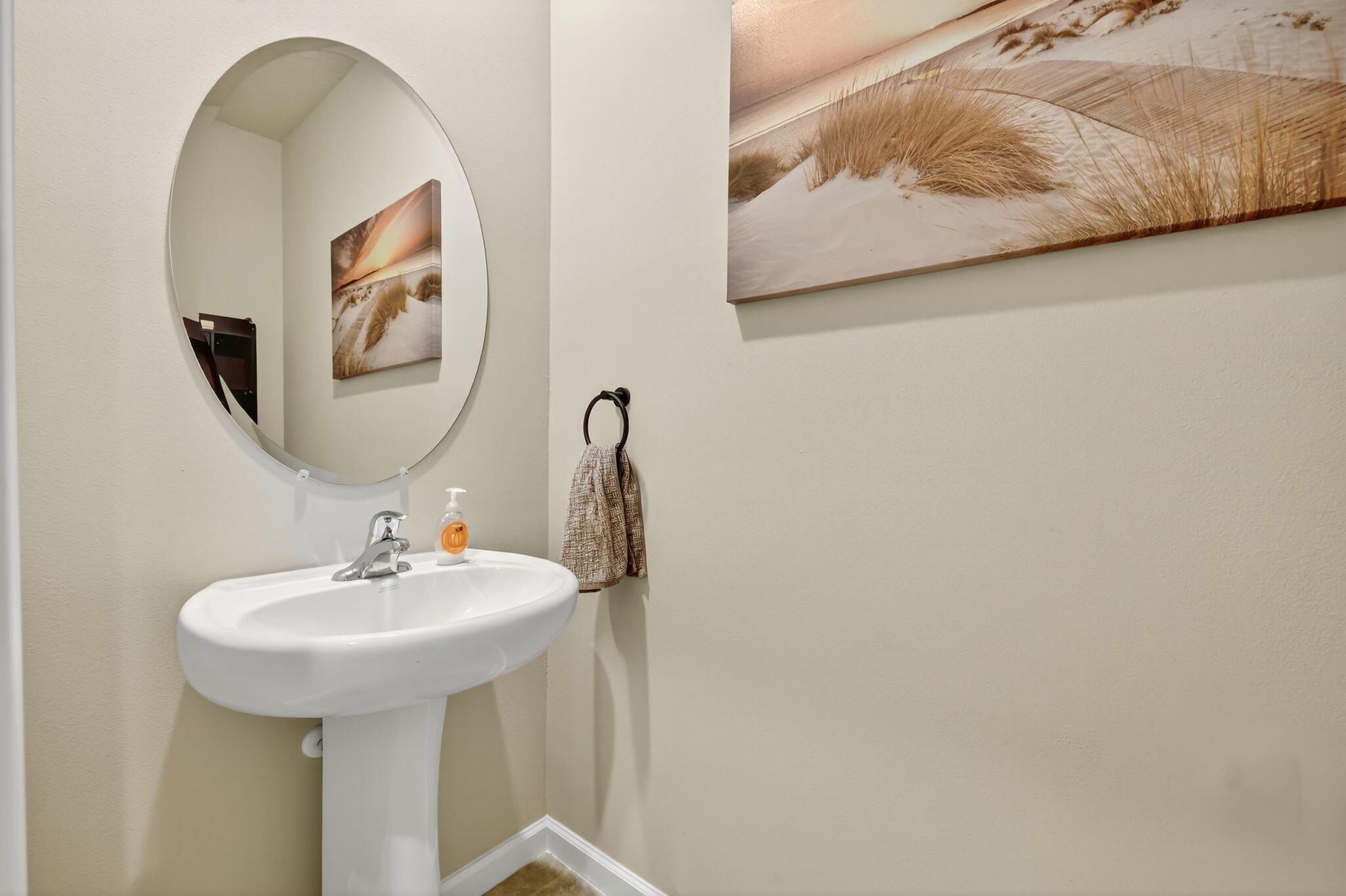 5672 Southeast Edgewater Circle Stuart, FL 34997 - Photo 13 of 26 a bathroom with a sink and a mirror