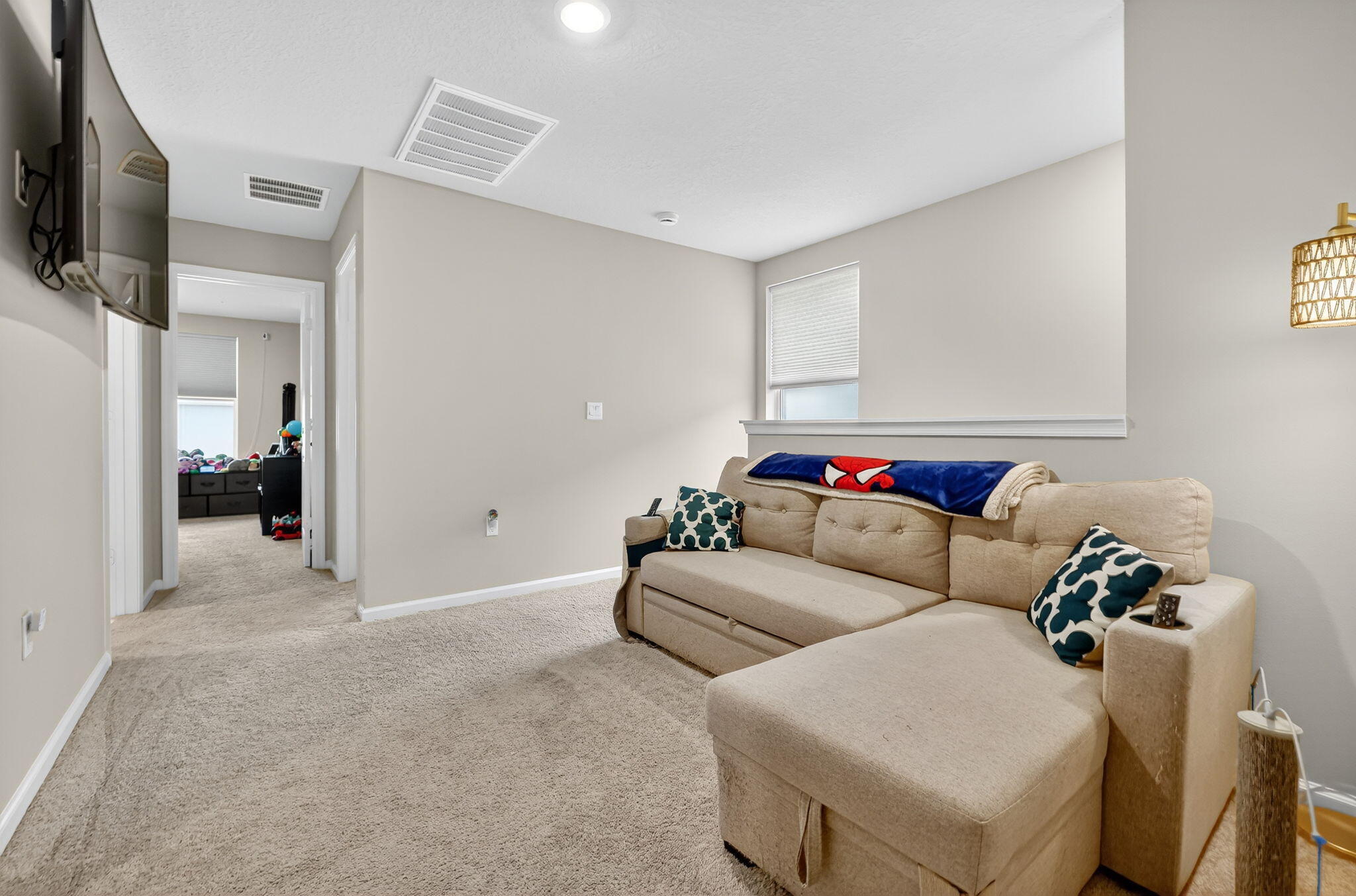5672 Southeast Edgewater Circle Stuart, FL 34997 - Photo 14 of 26 a living room with furniture and a flat screen tv