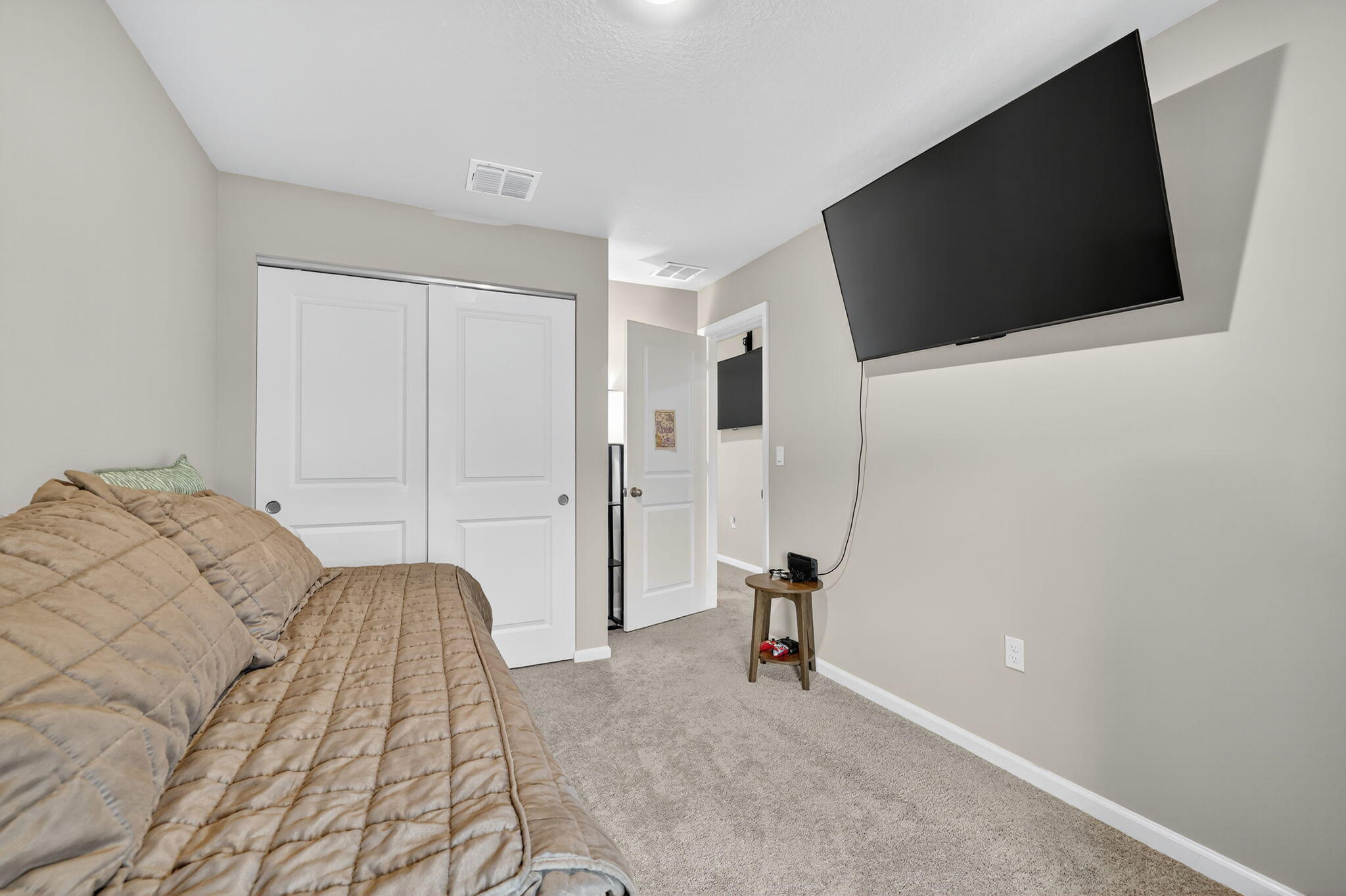 5672 Southeast Edgewater Circle Stuart, FL 34997 - Photo 15 of 26 a view of a livingroom with furniture and a flat screen tv