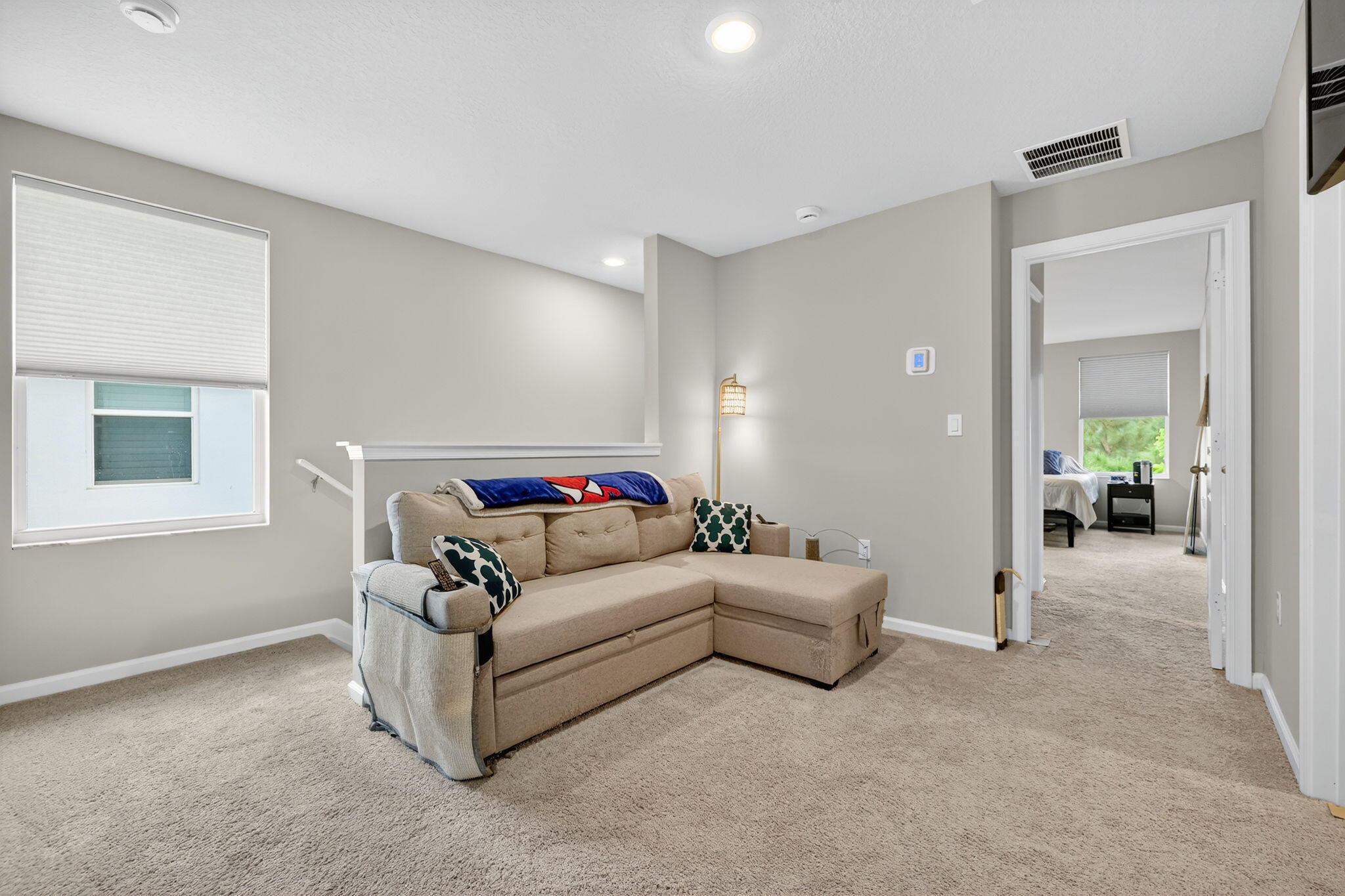 5672 Southeast Edgewater Circle Stuart, FL 34997 - Photo 16 of 26 a living room with furniture and a potted plant