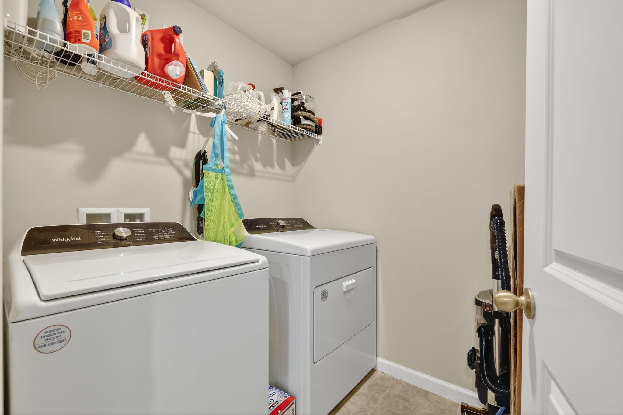 5672 Southeast Edgewater Circle Stuart, FL 34997 - Photo 21 of 26 a utility room with dryer and washer