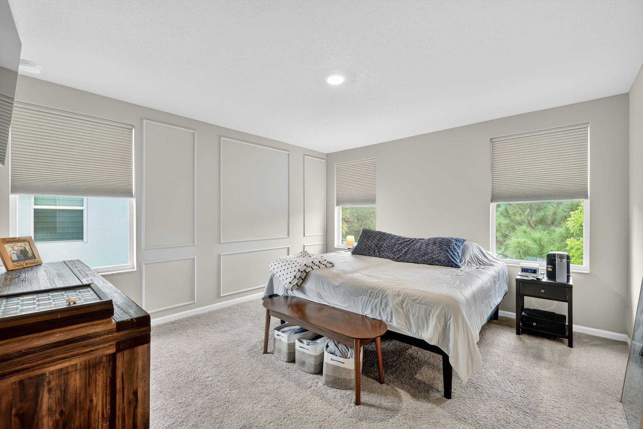 5672 Southeast Edgewater Circle Stuart, FL 34997 - Photo 22 of 26 a bedroom with a bed and a table