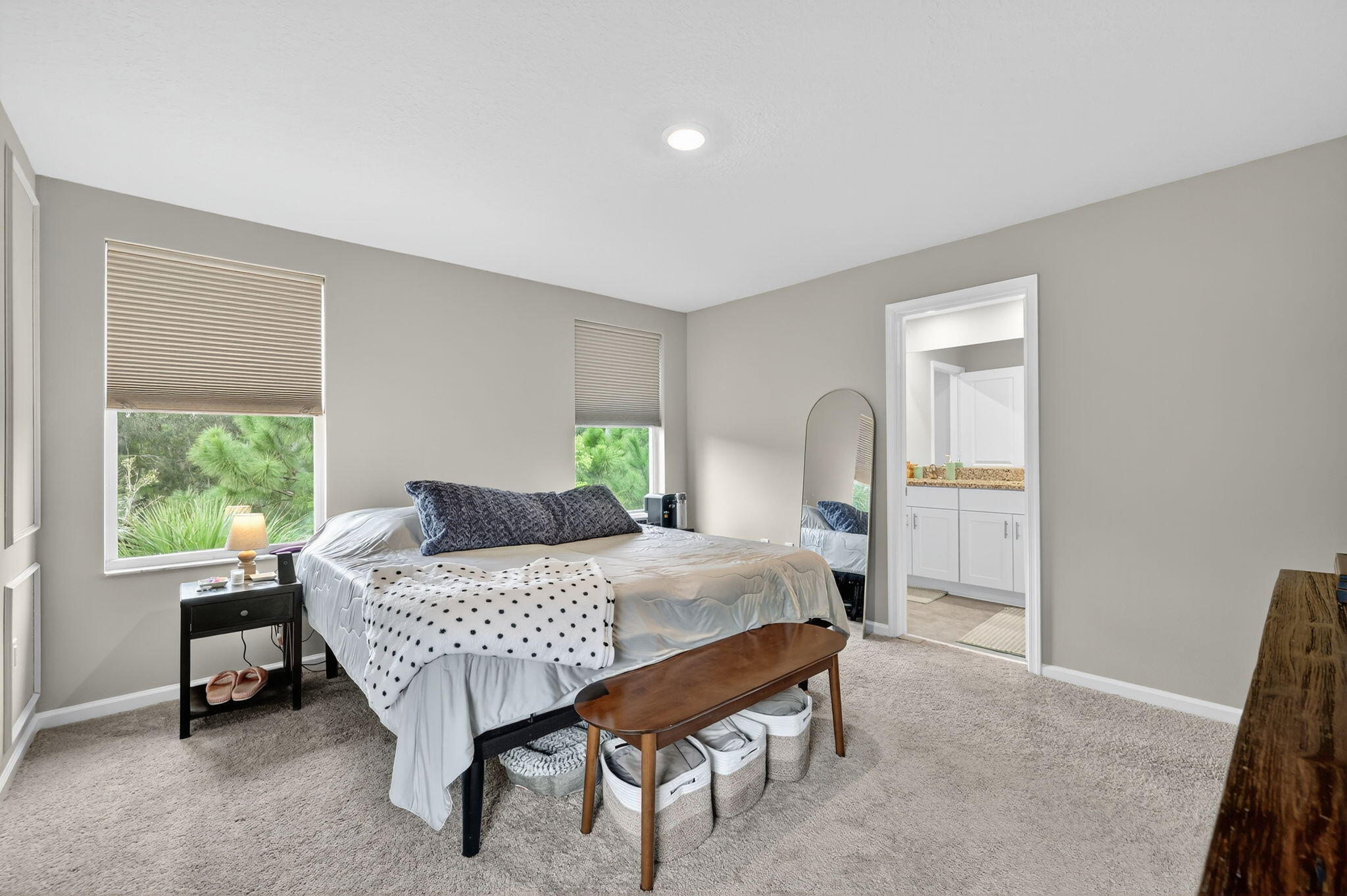 5672 Southeast Edgewater Circle Stuart, FL 34997 - Photo 23 of 26 a bedroom with a bed and a window