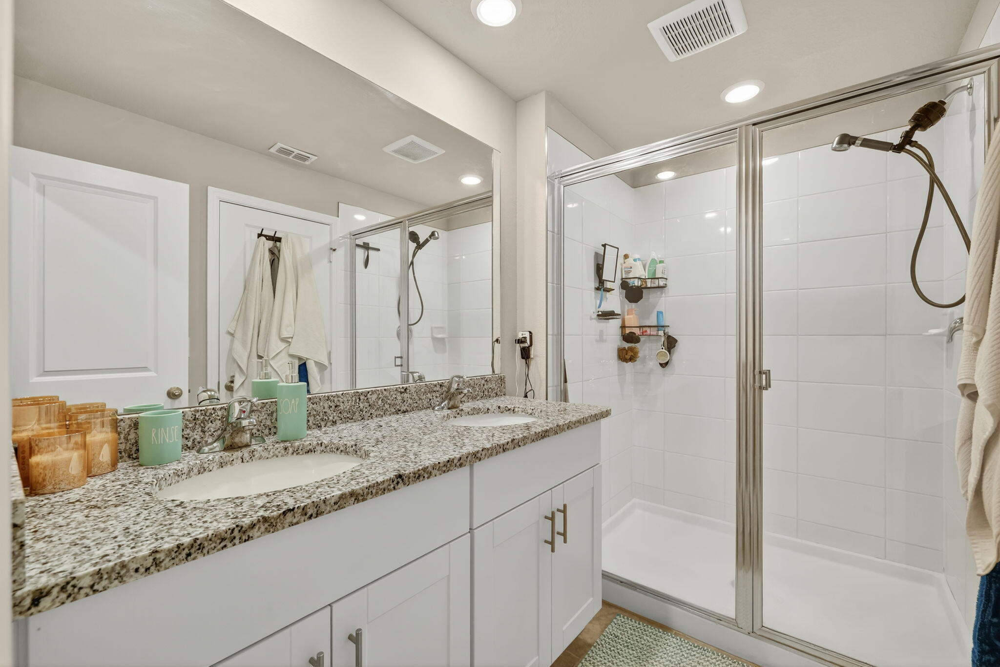 5672 Southeast Edgewater Circle Stuart, FL 34997 - Photo 24 of 26 a bathroom with a granite countertop sink mirror and double