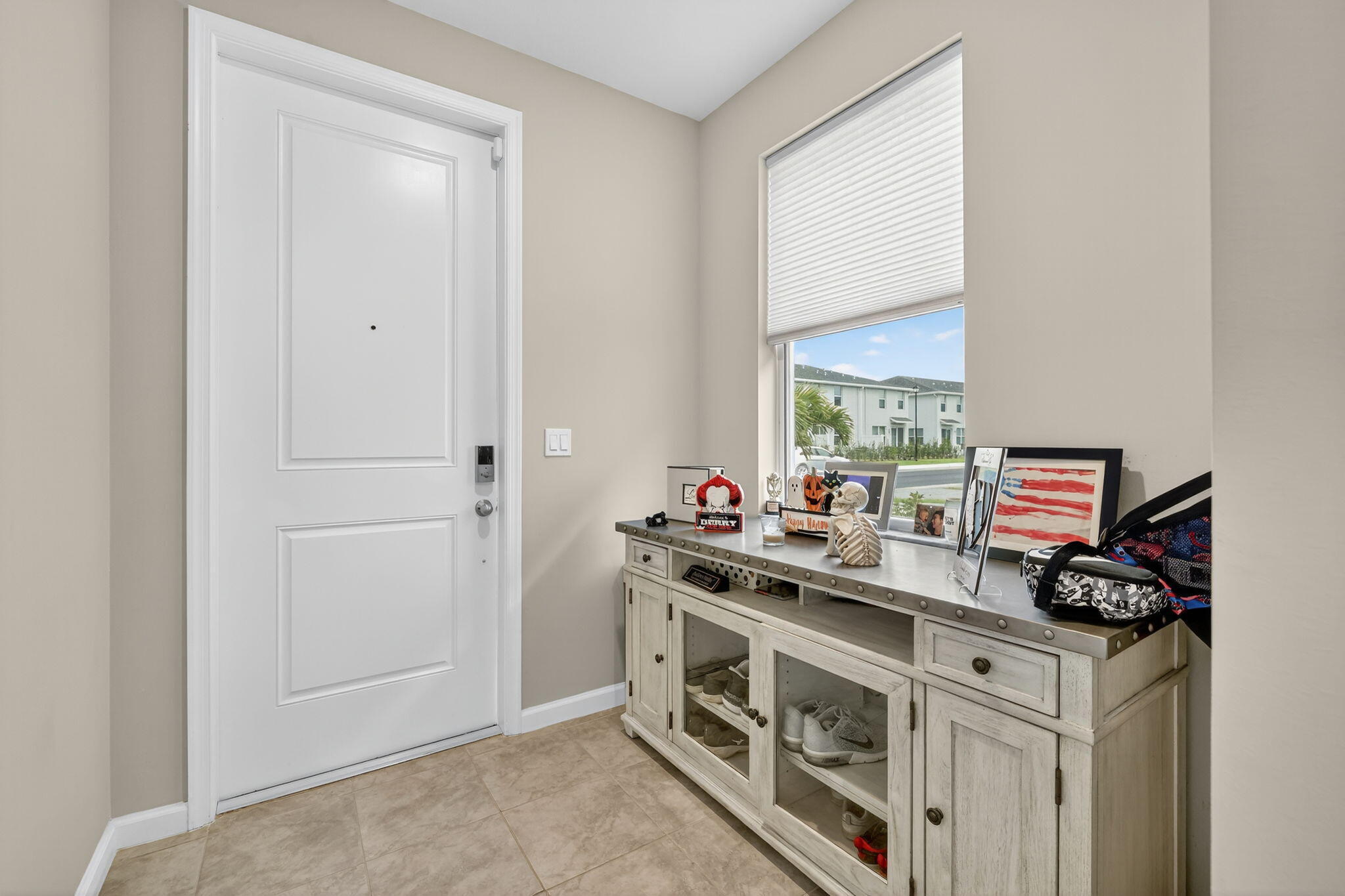 5672 Southeast Edgewater Circle Stuart, FL 34997 - Photo 3 of 26 a kitchen with a stove and a microwave