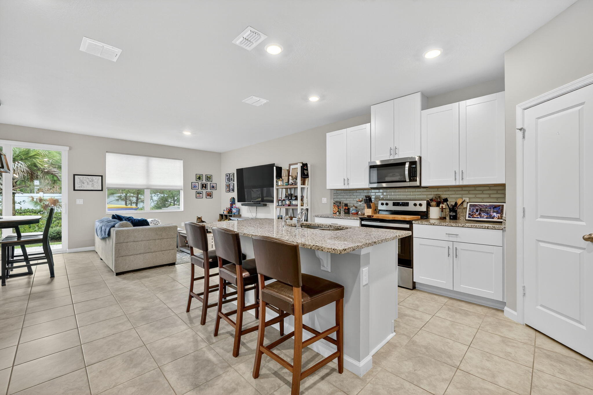 5672 Southeast Edgewater Circle Stuart, FL 34997 - Photo 5 of 26 a kitchen with counter top space appliances and a center island